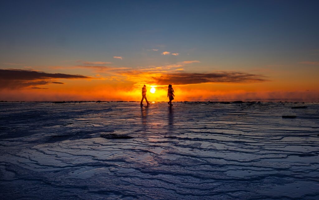Walking the drift ice at sunset