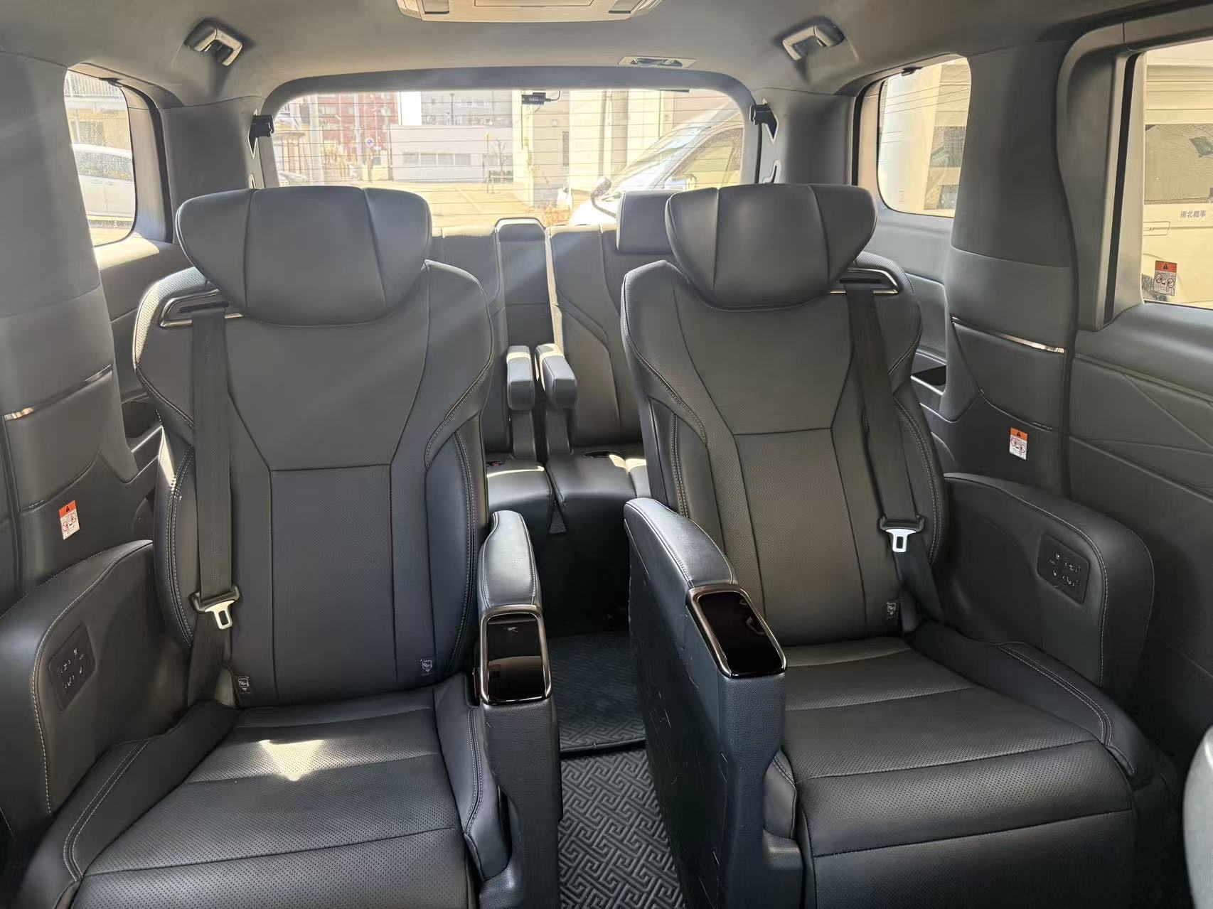 Executive captain seats with privacy console inside our latest Toyota Alphard private charter