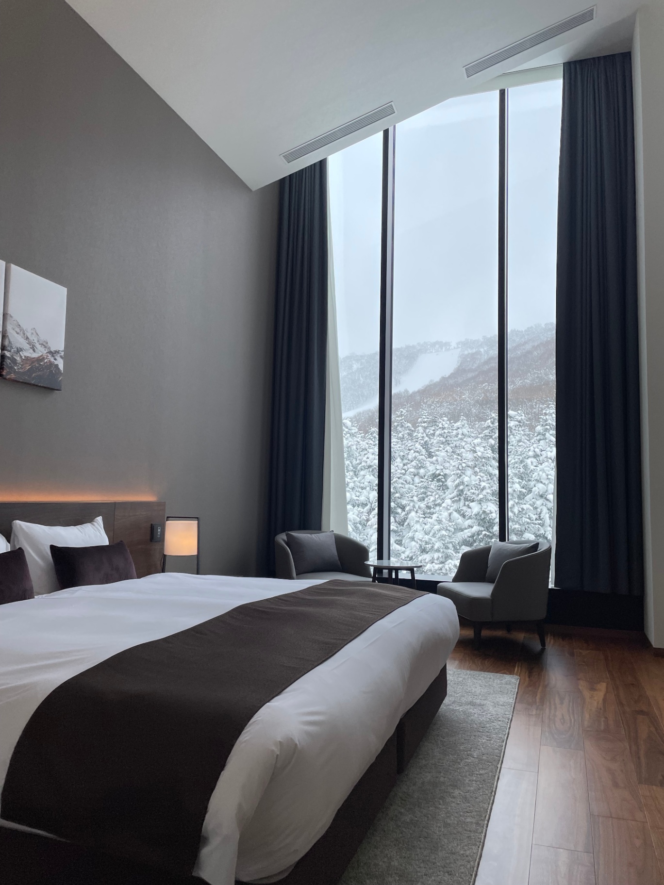 Loft bedroom overlooking a fresh snowfall on the Niseko ski field