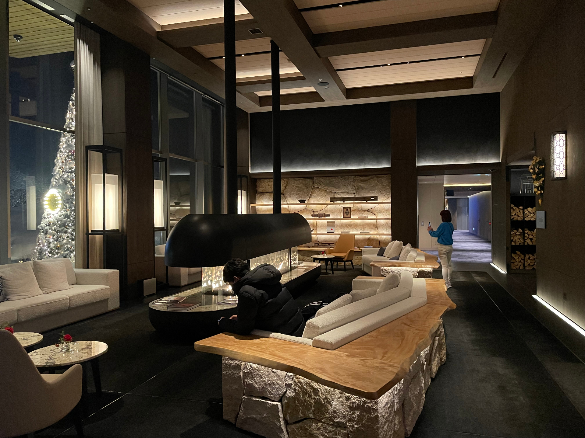Luxury resort lobby with fireplace and lounge seating in Hokkaido