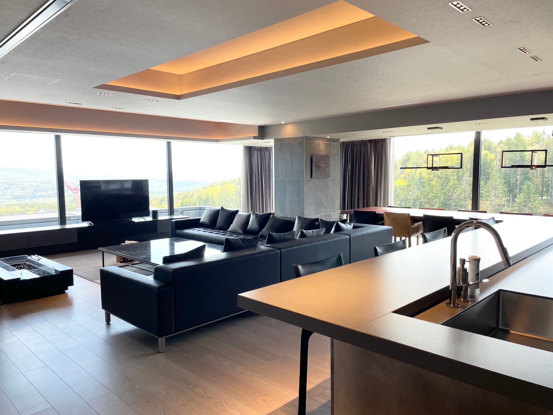 Luxury villa lounge with panoramic windows in Hokkaido