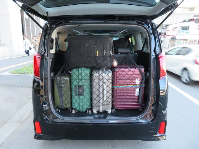 Toyota Hiace trunk loaded with suitcases for Hokkaido transfer service