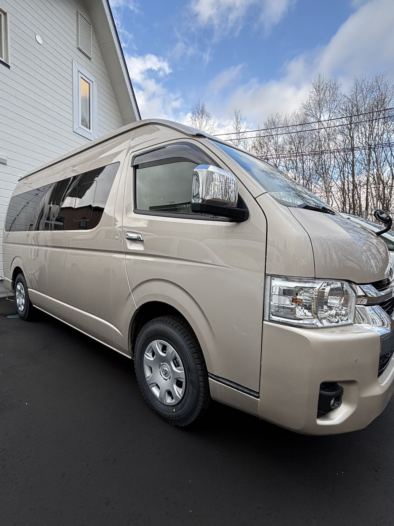 Toyota Hiace Grand Cabin in champagne pearl parked at a quiet Hokkaido residence